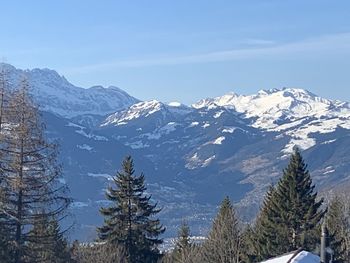 Scenic view of snowcapped mountains against sky