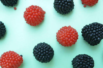 Close-up of strawberries on table against white background