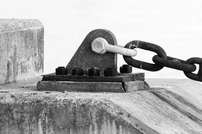 Close-up of metal against sky