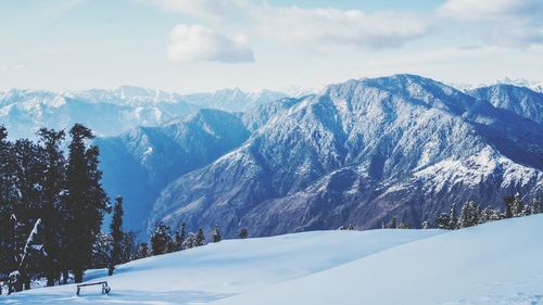 Scenic view of snowcapped mountains against sky