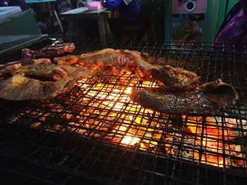 Close-up of meat on barbecue grill