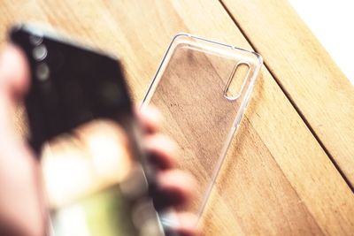 Close-up of hand holding mobile phone