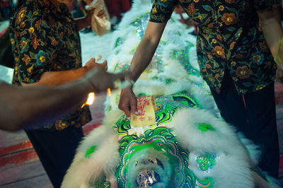 Midsection of chinese bride and groom during wedding ceremony