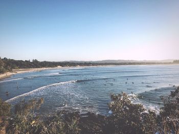 Scenic view of beach against clear sky