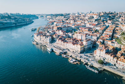 Aerial view of cityscape by river