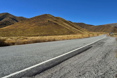 Mountain and farm on scenic road queenstown new zealand south