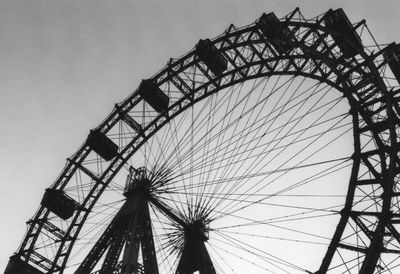 Low angle view of ferris wheel against sky