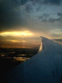 Aerial view of sea against sky during sunset