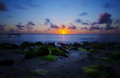 Scenic view of sea against sky during sunset