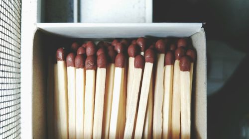 Close-up of matchsticks in box