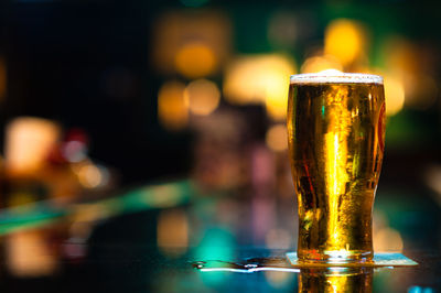 Close-up of beer glass on table