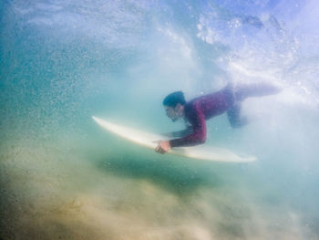 Man swimming in sea