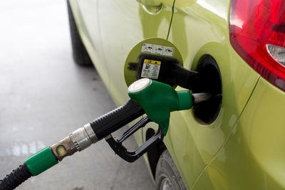 Close-up of car filling up gasoline