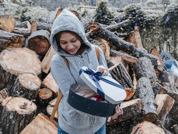 Full length of a smiling young woman in winter