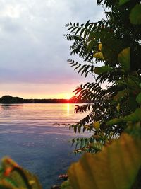 Scenic view of lake against sky during sunset