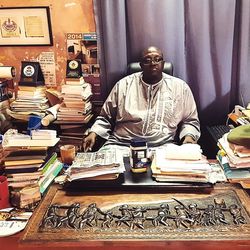 Man sitting on book