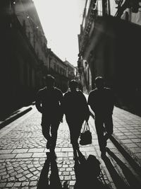 Men walking on street in city