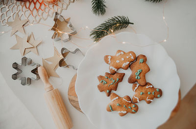 Funny home-made cookie in the form of a christmas tree, snowflakes and a snowman