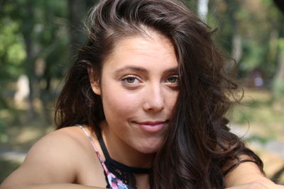 Close-up portrait of smiling young woman 