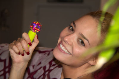 Close-up portrait of a smiling young woman