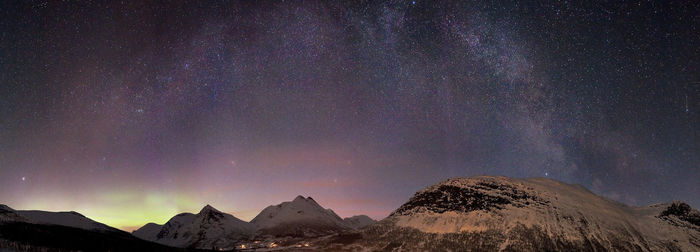 Scenic view of mountains against star field