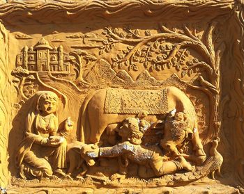 Statue of buddha in temple outside building