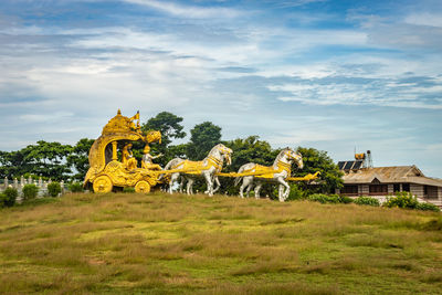 Holly arjuna chariot of mahabharata in golden color with amazing sky background