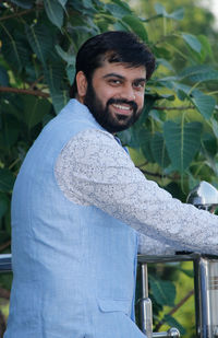 Portrait of young man standing outdoors