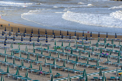 High angle view of chairs on beach