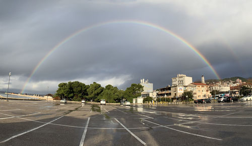 Panoramic view of rainbow over city