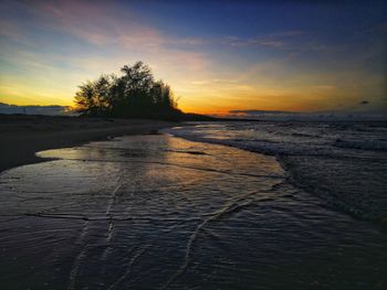 Scenic view of sea against sky during sunset