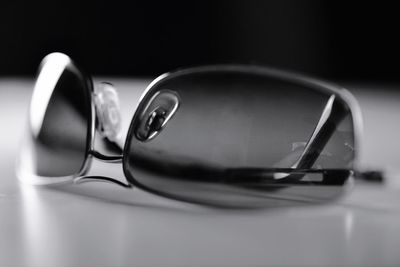 Close-up of sunglasses on table