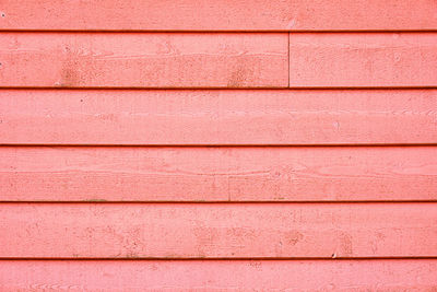 Background from a screen of boards painted in pink