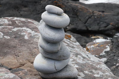 Close-up of stone stack on rock