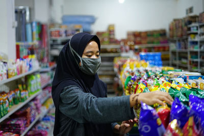 Full length of woman standing at market