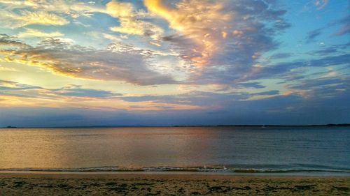 Scenic view of sea against cloudy sky