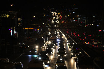 High angle view of illuminated street at night