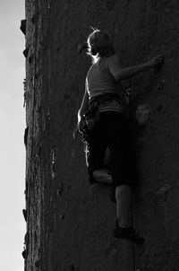 Full length of woman standing by railing