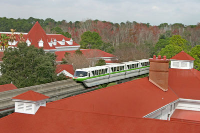 High angle view of text by building against sky