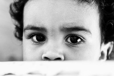 Close-up portrait of cute girl at home