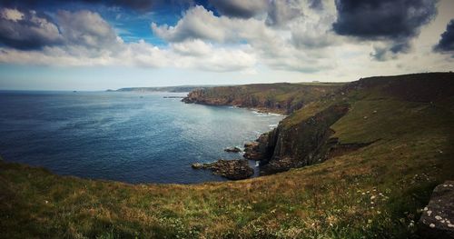 Scenic view of sea against cloudy sky