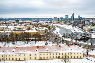 High angle view of buildings in city during winter