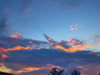 Low angle view of clouds in sky during sunset