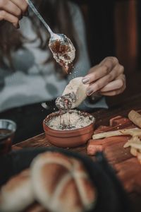 Midsection of person preparing food