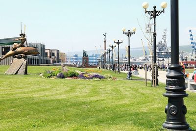 People in city against clear sky