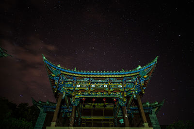 Low angle view of shrine at night