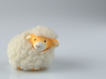 Close-up of sheep toy on table