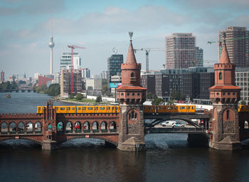 Bridge over river with buildings in background