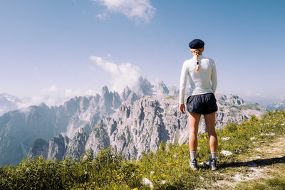 Woman hiking in the dolomite mountains