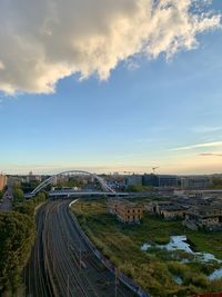 High angle view of road by buildings against sky